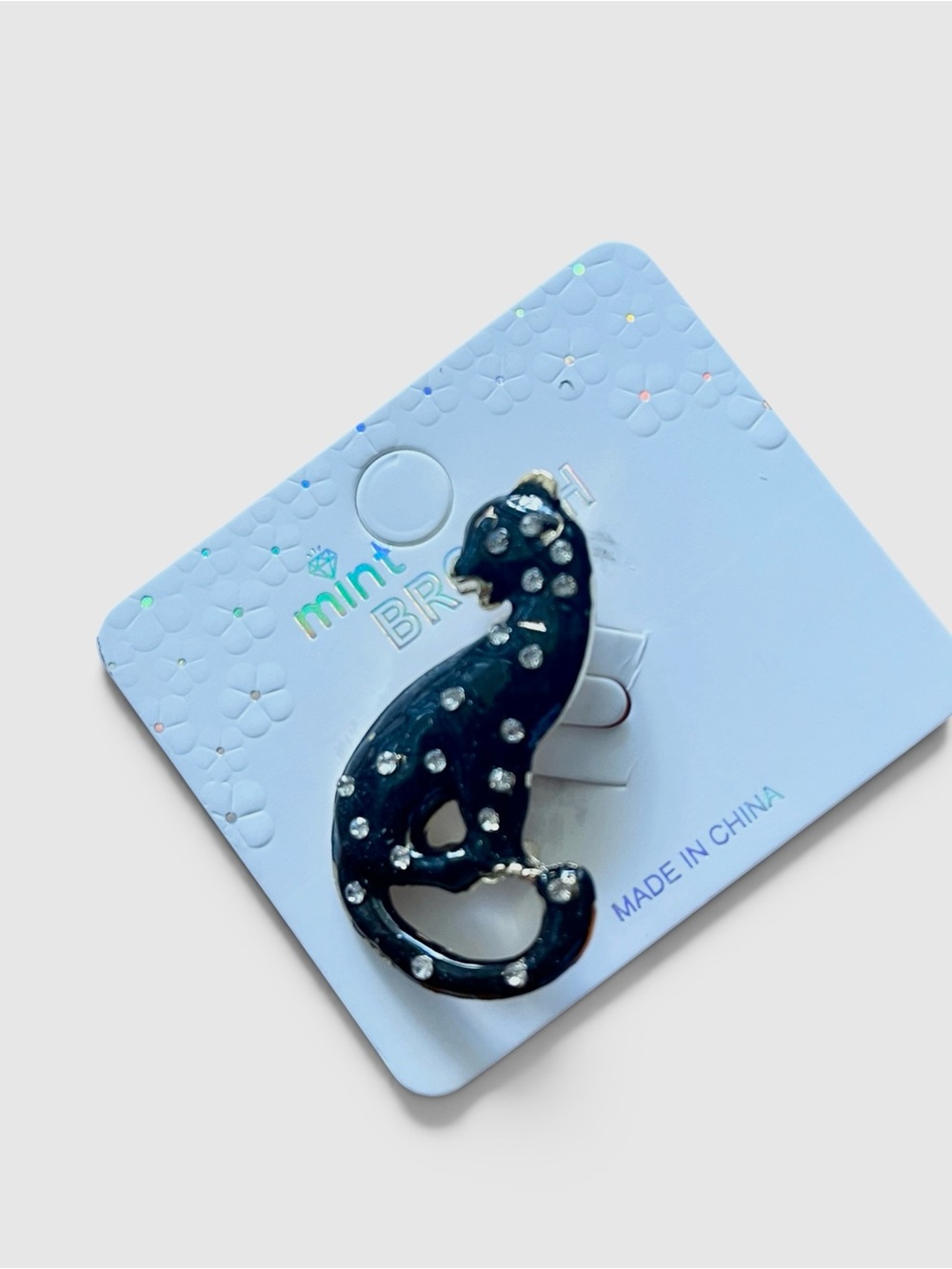 LEOPARD ENAMEL BLACK BROOCH ADORNED WITH CLEAR RHINESTONES